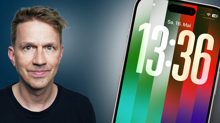David Neumann vor einem Smartphone-Display